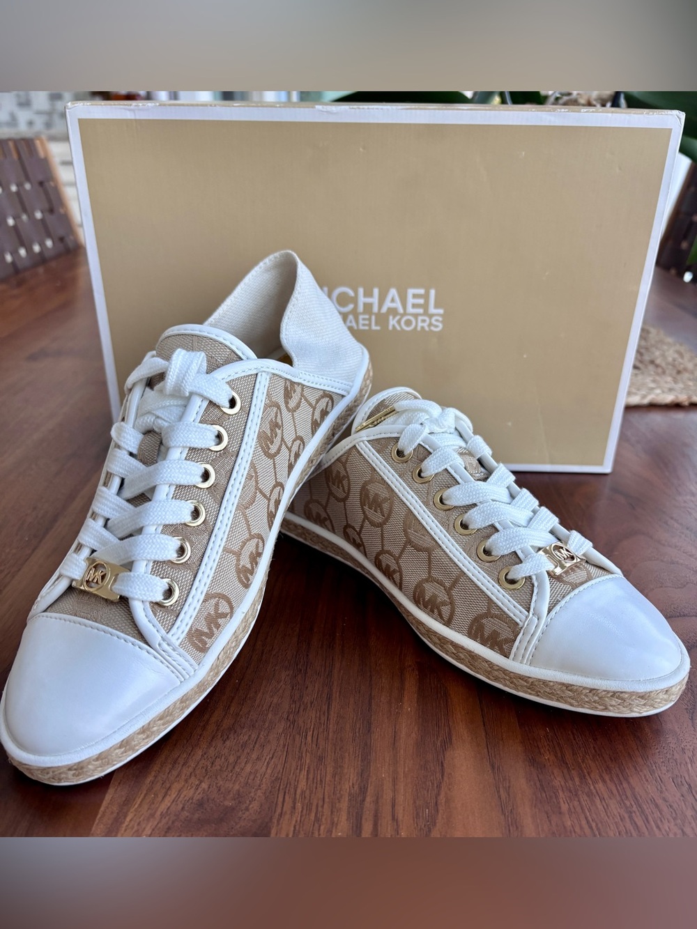 Brand New pair of Michael Kors Kristy Slide Sneakers in a cream and beige, 6.5.